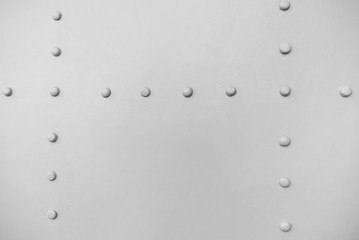 new painted gray matt chrome metal rivets on iron sheet, abstract pattern background, stock photo...
