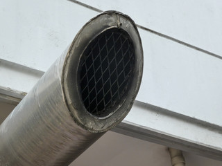 Ventilation and air conditioning pipe installed outside the building. Ventilation tube for...