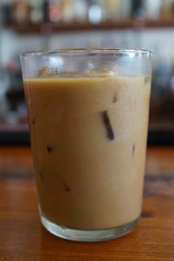 Glass of Iced Coffee with Milk on a Restaurant Bar