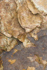 The surface of the river rocks with cracks