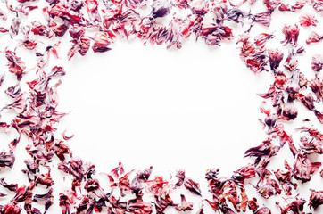 Top view of Dry Hibiscus petals frame on white background closeup