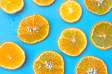 Summer of slice orange fruit on blue background.