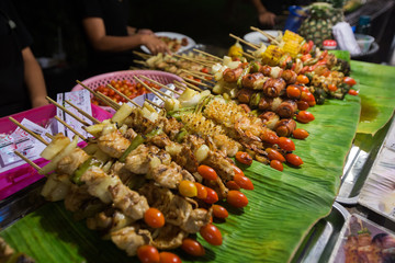 a food stand of fried vegetables on a Bamboo stick, Thailand