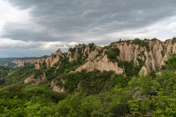 Fototapeta na wymiar Rozhen pyramids -a unique pyramid shaped mountains cliffs in Bulgaria, near Melnik town.