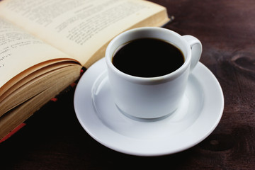 book with black coffee on the table
