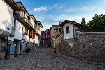  View of a narrow street in  historical part of  Plovdiv Old Town. Typical medieval colorful buildings. Bulgaria