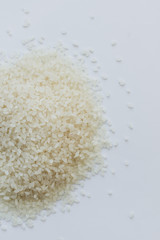 Pile of raw white rice in jar , macro 