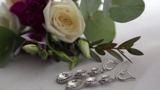 The bridegroom is dressing for wedding. Accessories for the bride, jacket, shoes, cufflinks. A groomed young man dressed up.