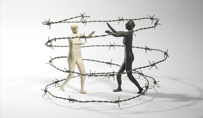 Fighters in a barbed wire arena. Competition concept. Isolated on dark background. Copy text space.