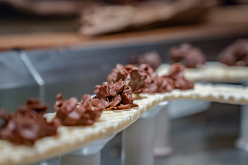 close up cereals corn flake cover with dark chocolate and arrange on the tower waffle sky line.