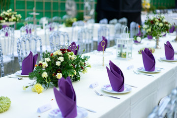 Luxury White - Purple - Red Dinner table set with Crystal chair in the garden.