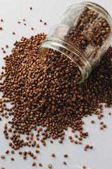 Raw buckwheat on white background