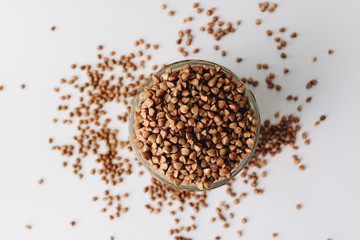 Raw buckwheat on white background