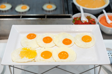 fried egg in large white square bowl at Thailand resort.