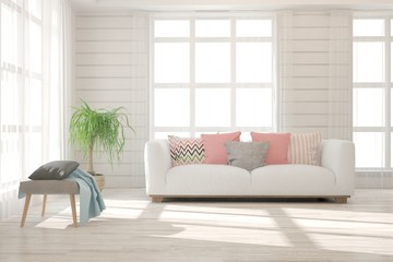 Fototapeta premium Stylish room in white color with sofa. Scandinavian interior design. 3D illustration