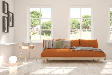 Stylish room in white color with sofa and summer landscape in window. Scandinavian interior design. 3D illustration