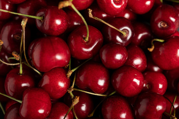 top view of red delicious ripe shiny cherries
