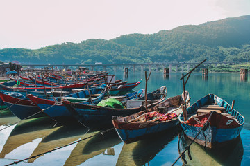 Wooden boats lined up at fishing village Lang Co, Hue, Vietnam.