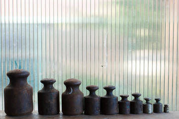 Naklejka premium old rusty weights for weighing products on the scales, old market weights
