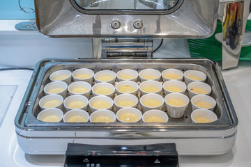 Poached eggs in large white square bowl at Thailand resort.