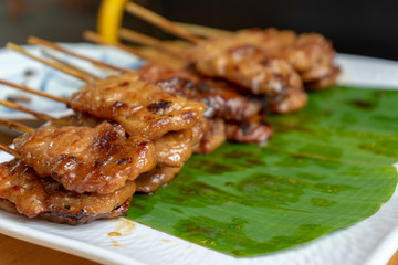 Thai grilled pork with wood stick was cooked and ready to eat.