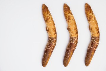 Traditional Balkan baguettes (or kifli) roll on white background.