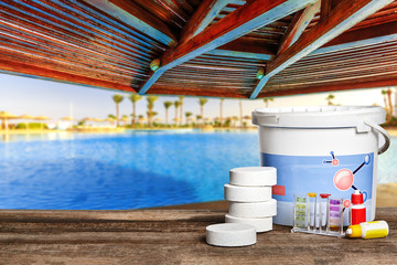 Equipment with chemical cleaning products and tools for the maintenance of the swimming pool.