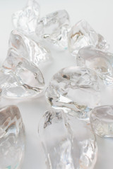 Fototapeta na wymiar Scattered crystals on white background, beautiful gems