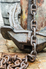 big old rusty anchor on dock closeup view