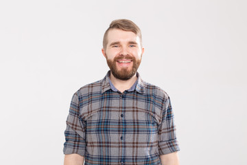 Fototapeta premium Handsome happy bearded man smiling and laughing on white background