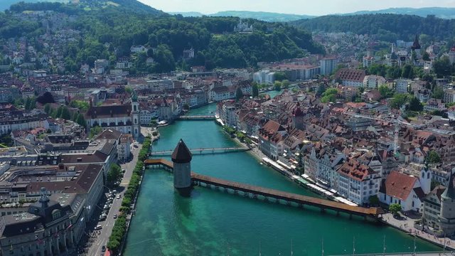 Aerial view of cityscape of Lucerne, historic centre of city, famous landmark Chapel Bridge (Kapellbr&uuml;cke) across river Reuss - landscape panorama of Switzerland from above, Europe