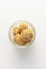 Healthy homemade cookies with nuts and sesame on white background