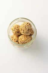 Healthy homemade cookies with nuts and sesame on white background