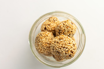 Healthy homemade cookies with nuts and sesame on white background