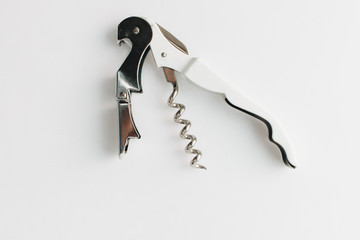 Metal corkscrew on white background