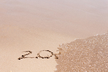 2019 or 2020 ends, leaving year, text on the sea beach. Happy new year concept.
