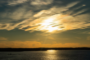 Beautiful sunset with clouds over lake Nasijarvi in Tampere, Finland