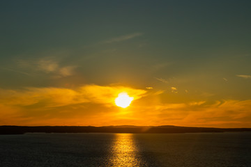 Beautiful sunset with clouds over lake Nasijarvi in Tampere, Finland