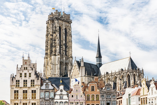 historical building on main sqaure Grote Markt and tower of St Rumbold's Cathedral, Sint Rombouts Kathedraal. Mechelen, Belgium