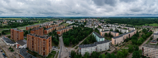 Aerial view of the city under dark storm cloudy sky. Just before the storm over the city. 
