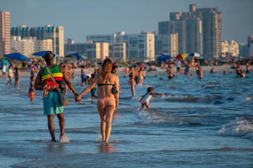 Clearwater Beach, Florida. June 24, 2019. People walking and enjoying the beach at Pier 60 area 3.