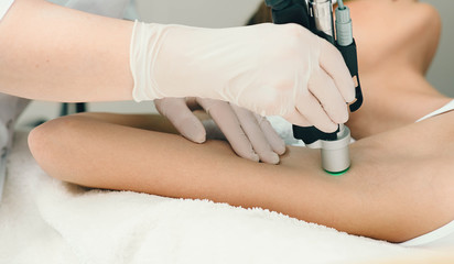 patient getting laser treatment on armpit, close up. Laser hair removing on armpit
