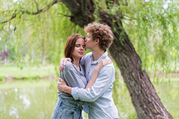 Fototapeta premium Young girl and boyfriend closeup, concept of happiness and love.
