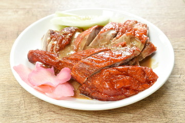 roasted duck meat and pickled ginger dipping sweet soy sauce on plate