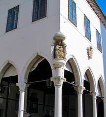 Gothic loggia in the old town of Koper, Slovenia. The restaurant in the building of the Loggia...