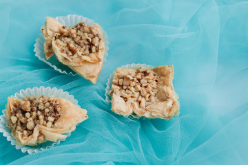 Baklava dessert. Pastry made of layers of filo filled with chopped nuts and sweetened and held...