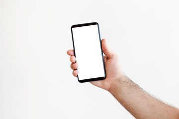 Touch screen mobile phone, in hand with clipping path