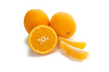 Naklejka na ściany i meble Fresh orange whole, half, and slices on white background