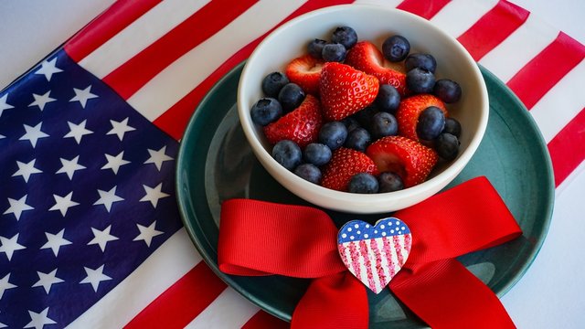 USA 4th of July party fresh berry bowl, patriotic table decor.