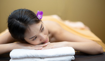 Obraz na płótnie Canvas Beautiful young woman in spa salon, Body care. Spa body massage woman hands treatment. Woman having massage in the spa salon